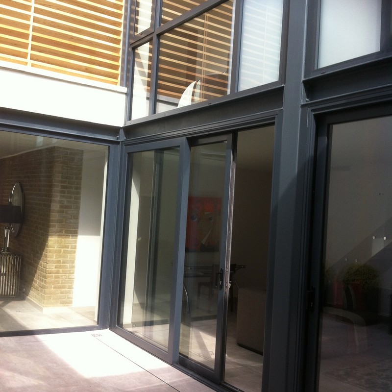 Anthracite aluminium sliding patio doors fitted in Raynes Park