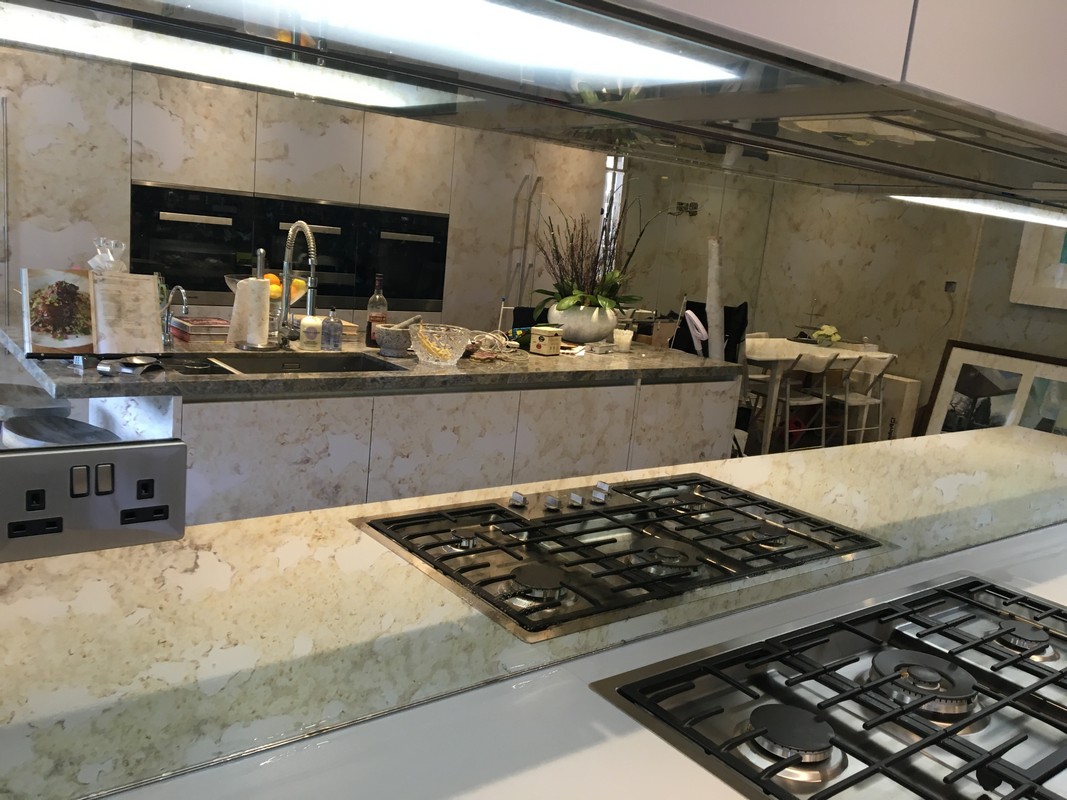 Mirror glass splashback in Raynes Park luxury kitchen
