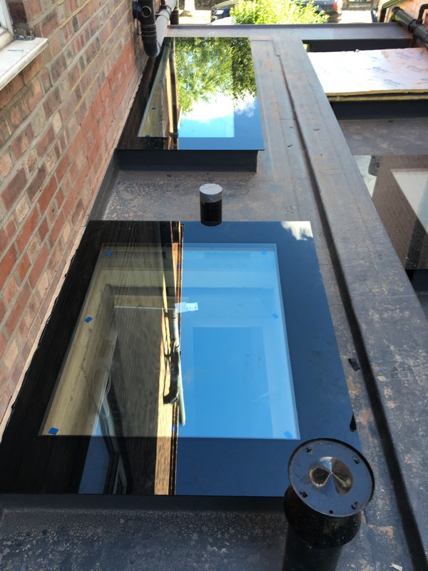 Multiple flat roof skylights on extension in Raynes Park